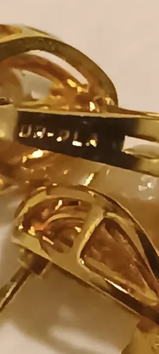 Pendientes oro y plata con detalles brillantes