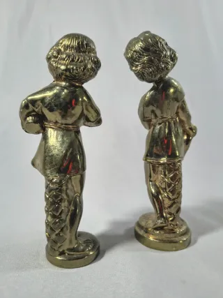 Pareja de figuras Infantiles de metal.