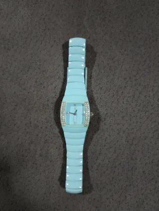 Reloj azul con brillantes, sin pila