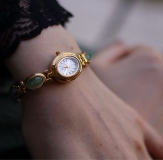 Orologio donna elegante oro e pietre verdi