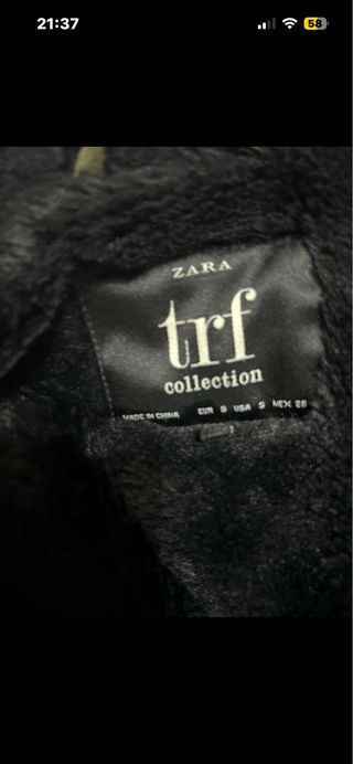 Parka Zara verde y negra con capucha