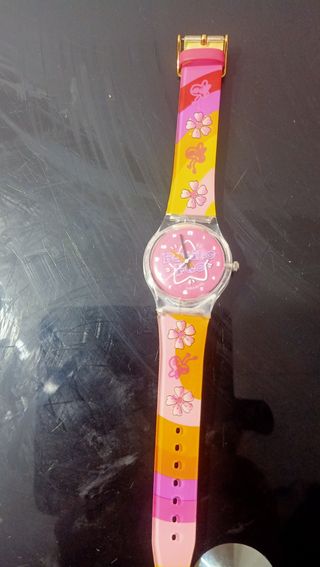 Reloj infantil con flores y lazos