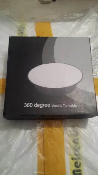 Expositor giratorio eléctrico y pilas con espejo