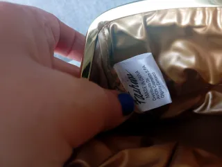 Bolsito neceser guardatodo dorado y burdeos