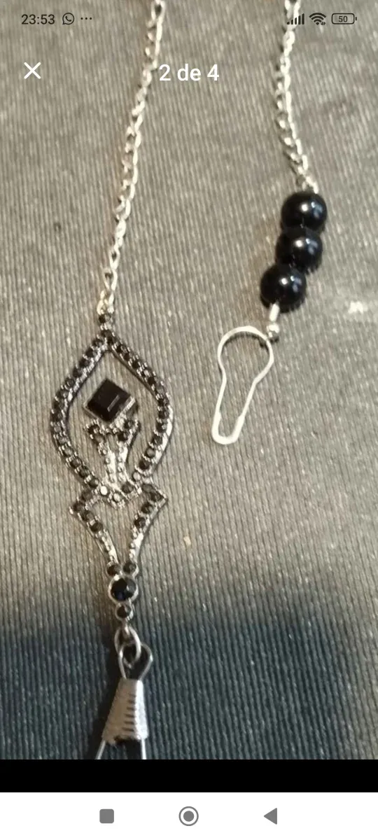 Abaniquero perlas negras cadena plateada y con un