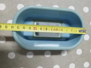 Bañera y espejo para pájaros.