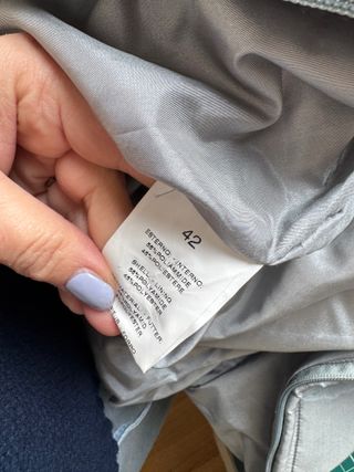 Piumino grigio con cappuccio e pelliccia