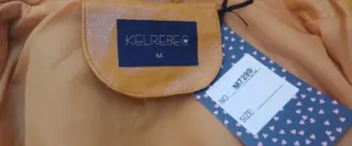 Cazadora polipiel efecto charol mostaza