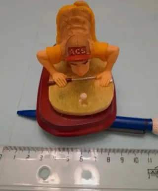 Bolígrafo golf y figura pisapapeles