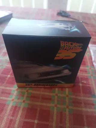 Moneda de oro con estuche regreso del futuro