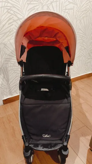 Carro de bebé rosa y negro