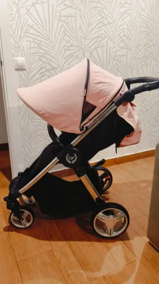 Carro de bebé rosa y negro