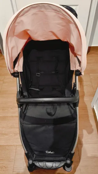 Carro de bebé rosa y negro