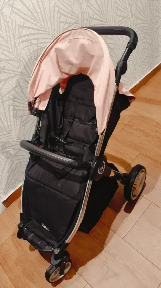 Carro de bebé rosa y negro