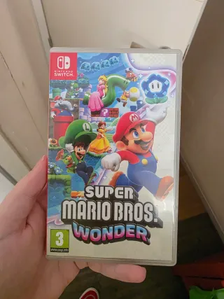 Nintendo Switch OLED Blanca con juego y mando.