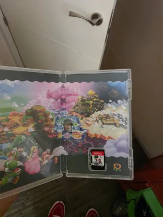 Nintendo Switch OLED Blanca con juego y mando.