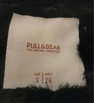 Cazadora pelo negra con capucha