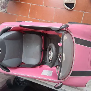 Cochecito infantil rosa a empujar