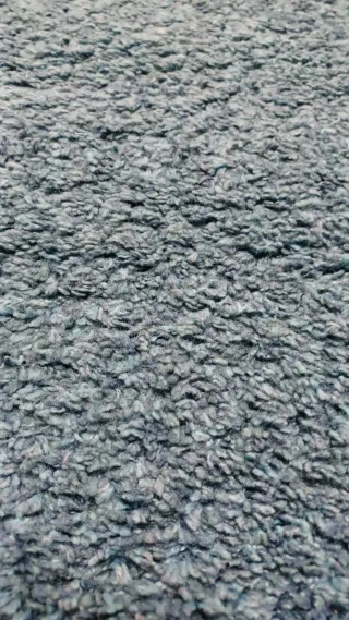 Alfombra azul con estrella blanca