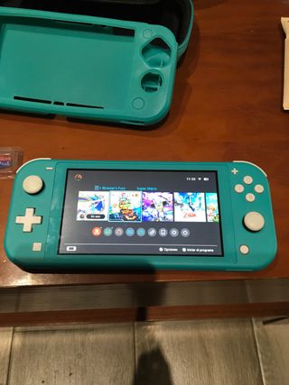 Nintendo Switch Lite , estuche cristal y tarjetaSD