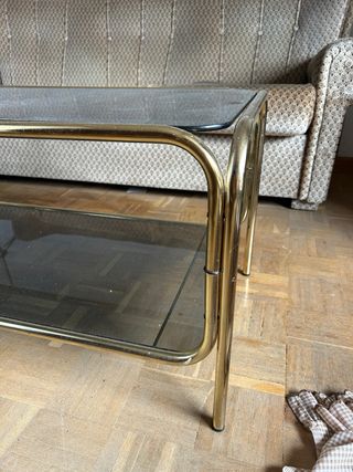 Mesa de centro vintage de cristal y metal dorado