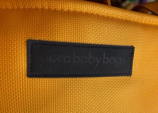 Bolsa carrito bebé impermeable color mostaza