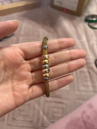 Pulsera dorada y plateada
