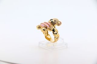 ANILLO OSO CON CIRCONITAS ROSAS. Oro 18k.