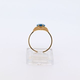 LANZADERA CIRCONITAS AZUL. Oro 18k.