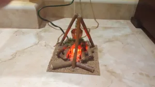 Hoguera eléctrica con caldero