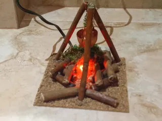 Hoguera eléctrica con caldero