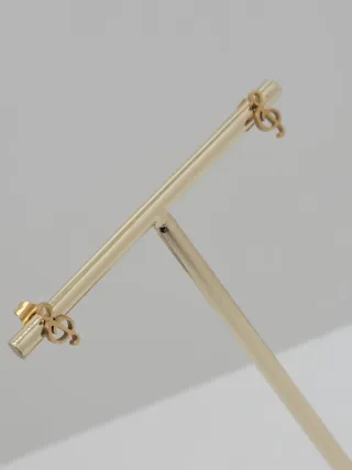 Pendientes clave de sol dorados