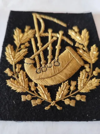 Parche bordado de gaitero escocés