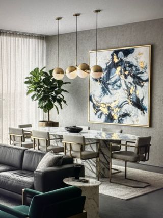 Mesa de comedor y sillas de mármol y metal