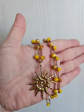 Collana con ciondolo sole dorato