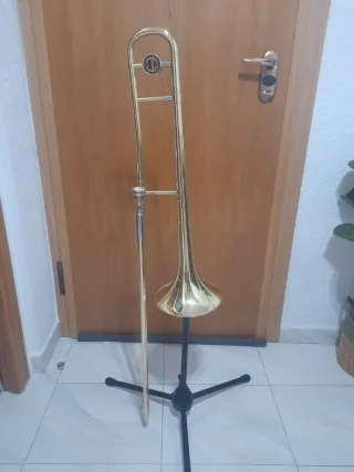 Trombon de varas dorada con funda