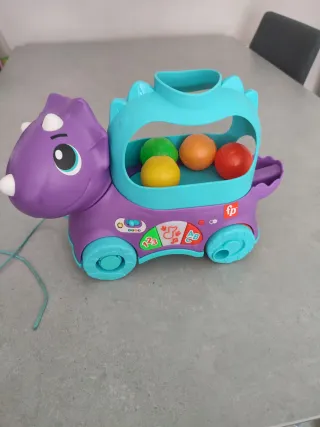 Dinosaurio Fisher-Price con pelotas