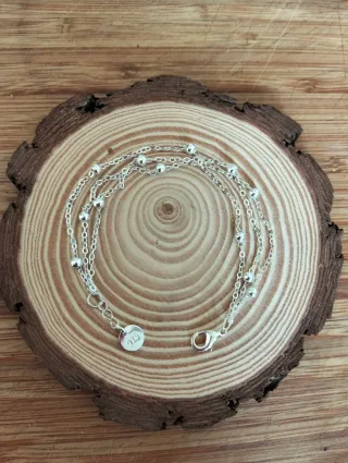 Pulsera triple cadena con bolitas