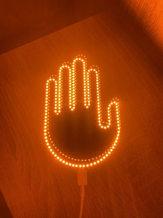 Mano LED con control remoto