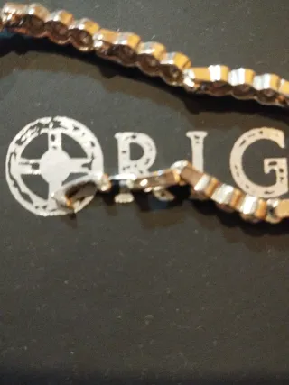 Pulsera circonitas plateada.