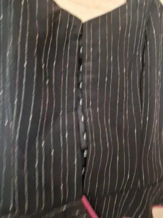 Traje de flamenca negro con volantes