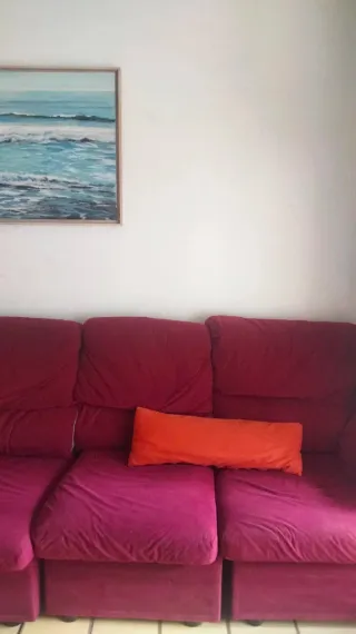 Sofá vintage cuatro plazas rojo