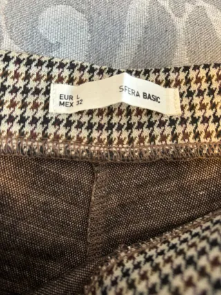 Pantalones de cuadros beige y negro