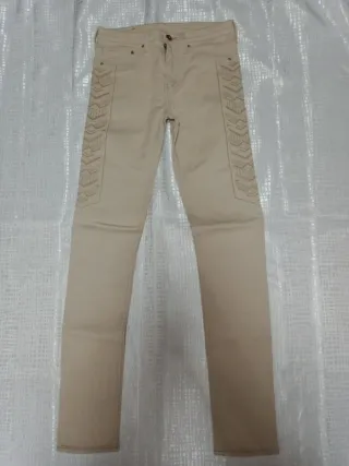 Jeans beige con decorazioni laterali