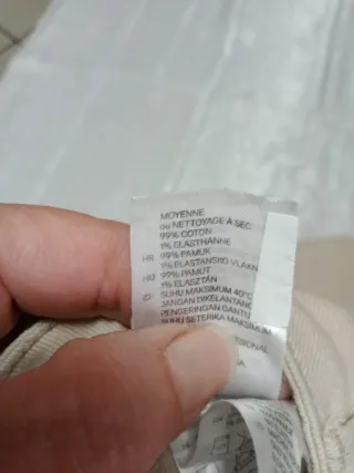 Jeans beige con decorazioni laterali