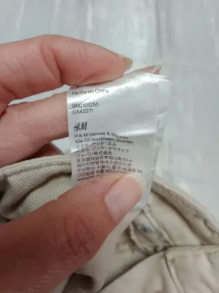 Jeans beige con decorazioni laterali