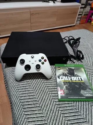 Xbox One X 1TB con mando y juegos