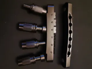 Puente guitarra Tune-o-matic negro.