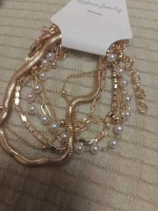 Lote de pulseras doradas