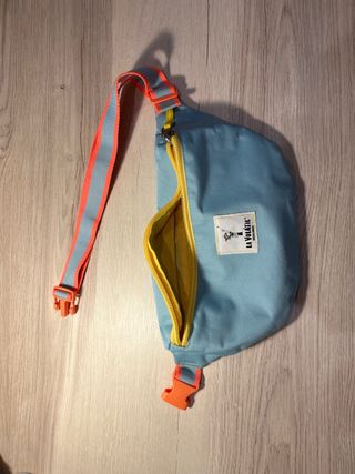 Riñonera La Volátil azul y amarilla